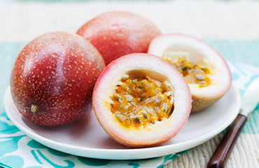 Passion fruits on blue napkin Outdoor background