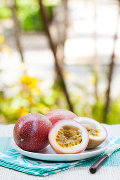 Passion fruits on blue napkin Outdoor background