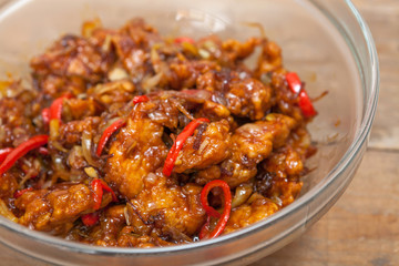 Chinese food, fried chicken with vegetables in spice source