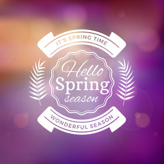 Spring Vintage Typographic Badge on Colorful Blurred Background. Spring Vector Illustration. Hello Spring. Greeting Card Design