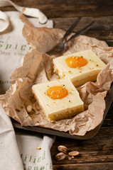 Two pieces of fresh apricot cake with pistachios. Rustic style. Selective focus.