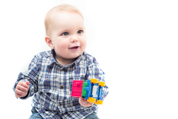Baby boy holding toy car