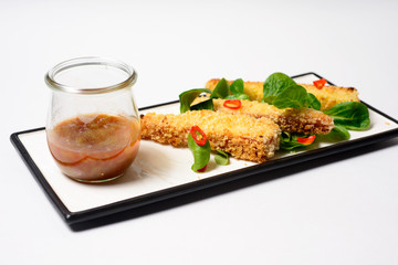 fried mozzarella sticks tomato sauce served with greens