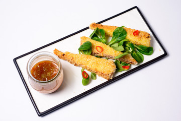 fried mozzarella sticks tomato sauce served with greens