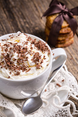 Cup of hot cappuccino with homemade oat cookies for breakfast.