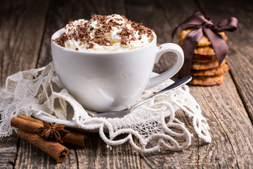 Cup of hot cappuccino with homemade oat cookies for breakfast.