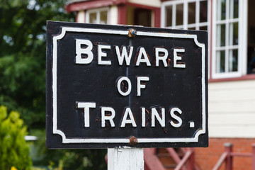 Obraz premium Beware of Trains. A Beware of Trains sign on the South Tynedale railway in Northern England.