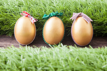 three golden easter eggs