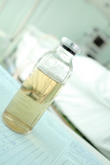 Bottle containing medicament on the desktop in a hospital ward