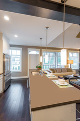 Modern, bright, clean, kitchen interior with stainless steel appliances in a luxury house
