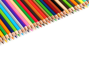 Drawing colourful pencils on a white background, close up