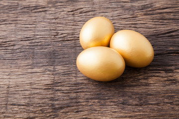 three golden easter eggs