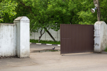 old metal gate at entrance to the plant