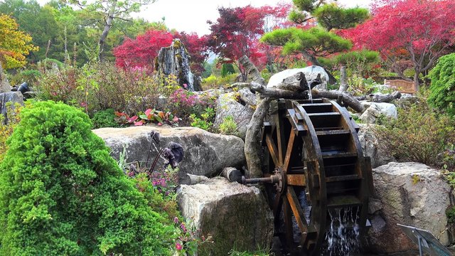 Ornamental Water mill at The Garden of Morning Calm at autumn. Gapyeong