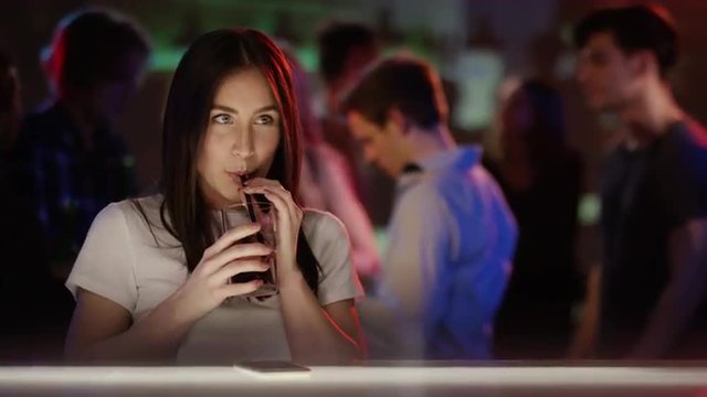 Girl in club looking for boys