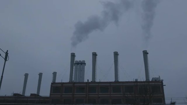 a Huge Plant With Big Chimneys in Smoke