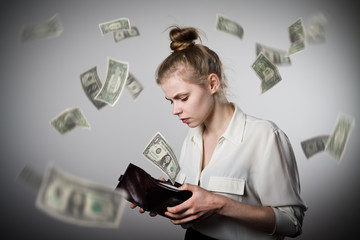 Woman and wallet. Dollars.