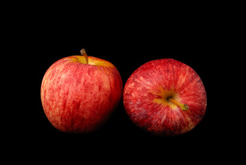 red apple on black background