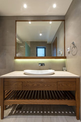 Fototapeta na wymiar Lavatory and mirror in modern bathroom interior