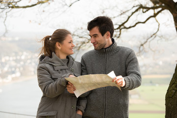 young couple with map