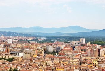 Fototapeta na wymiar Picturesque city of Girona surrounded by mountains