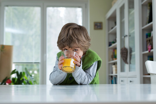 Little Boy Drinking Range Juice