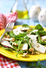 Chicken salad with salad mix and walnuts.