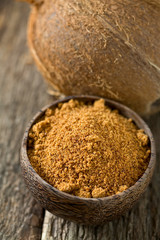 coconut palm sugar on wooden surface