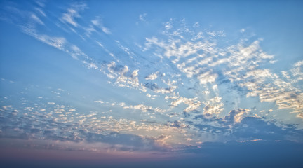 Blue sky with clouds and sun rays