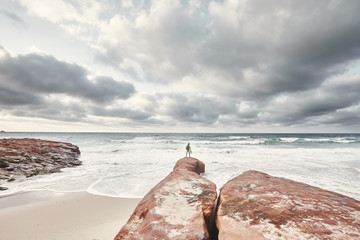 Guy with helmet near sea