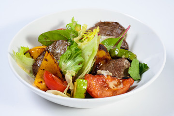 salad with meat,egg, tomatoes, olives and vegetables
