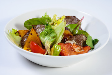 salad with meat,egg, tomatoes, olives and vegetables