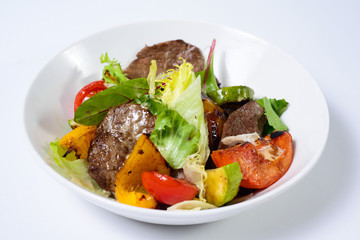 salad with meat,egg, tomatoes, olives and vegetables