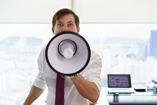 Angry Businessman Corporate Worker Screams With Megaphone