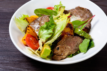 salad with meat,egg, tomatoes, olives and vegetables