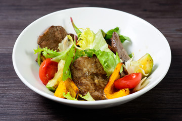 salad with meat,egg, tomatoes, olives and vegetables