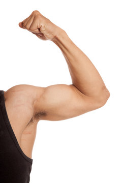 Close up Muscular Asian man arm flexing biceps