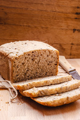 Sliced whole wheat bread on cutting board