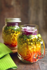 Fototapeta na wymiar Fresh vegtable salad in a mason jar.
