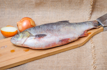 Raw fish  ide on a chopping Board