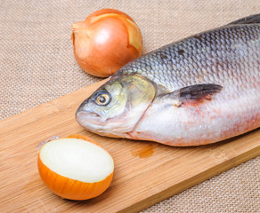 Raw fish  ide on a chopping Board