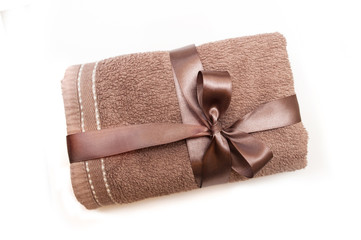 brown towel tied with a ribbon and bow