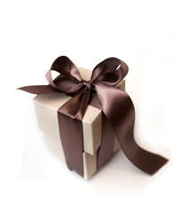 Gift boxes with brown bow on a white background