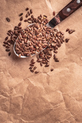 Flax seeds linseed on kitchen spoon