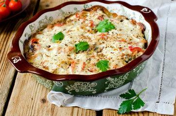 Carp baked with sour cream, pepper, bacon and onions