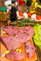 Various raw red meat with flavorings