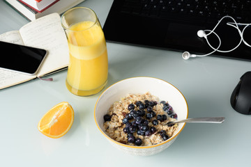 Organic breakfast with orange juice on table, top view.