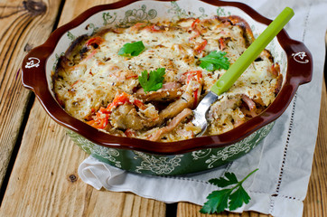 Carp baked with sour cream, pepper, bacon and onions