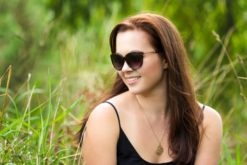 Beautiful Smiling Woman in Grass