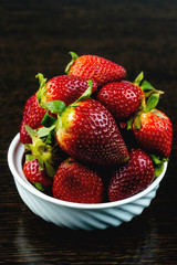 Half of strawberry isolated on black background